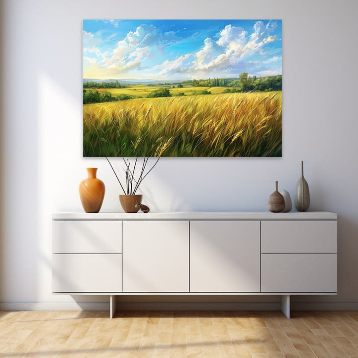 Golden barley field with rolling green hills under a billowing summer sky