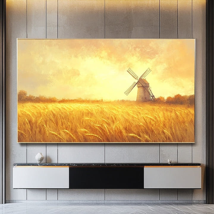 Golden wheat field with a traditional windmill under a warm amber sky