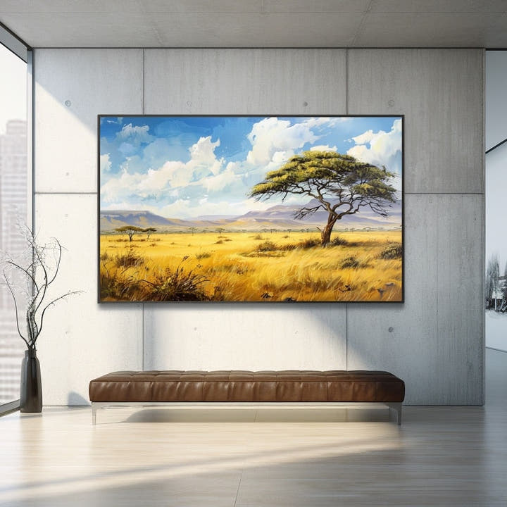 Golden savanna grasslands and acacia tree before flat-topped mountains