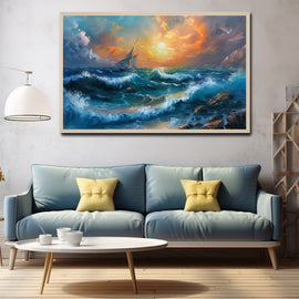 Sailing boat against a blazing sunset over deep blue cresting waves
