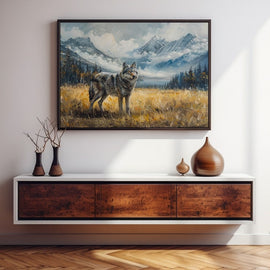 Painted grey wolf standing in a golden mountain meadow