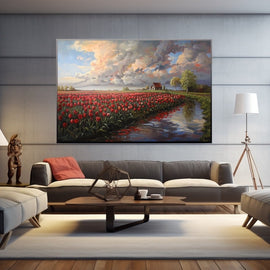 Red tulip field by a waterway under a dramatic sunset sky