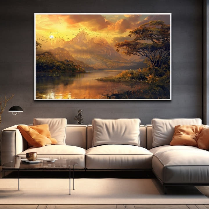 Sunset over a mountain lake with a peak, birds and a tree