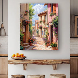 Flower-filled cobbled lane between sun-baked Provencal village houses