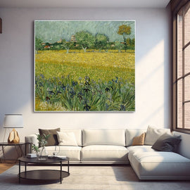Van Gogh landscape painting of a green field with purple irises and a distant town