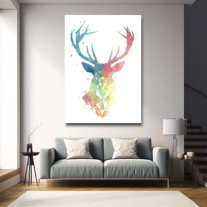 Geometric stag head in turquoise, coral and gold facets on white