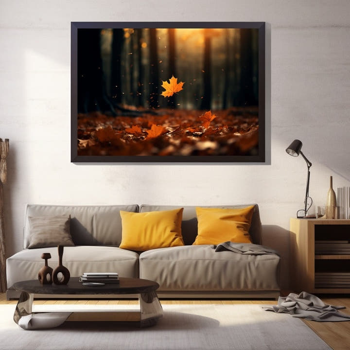 Single maple leaf falling through a misty sunlit autumn forest