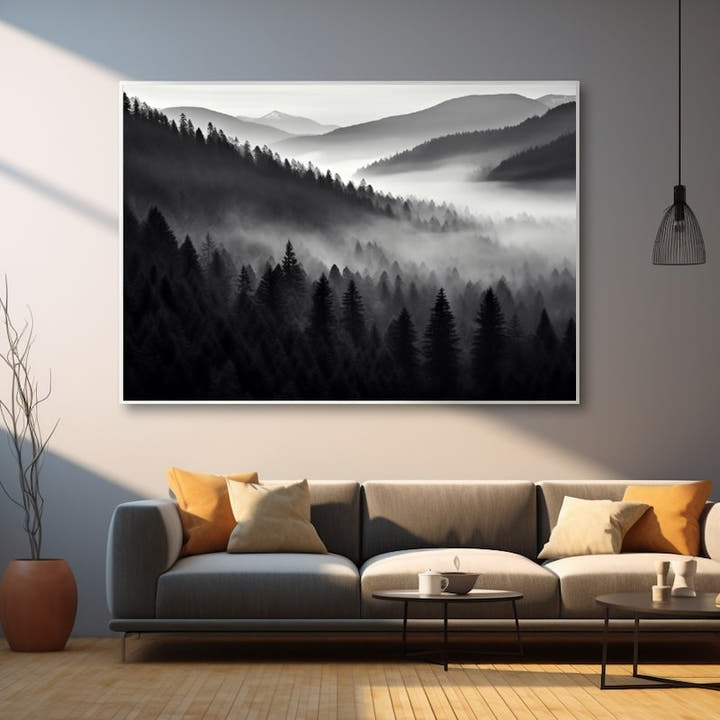 Misty layered forest ridges fading to a distant peak in black and white