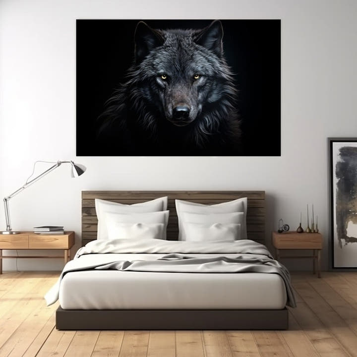 Silver-grey wolf face emerging from a black background with golden eyes