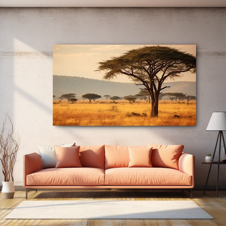 Lone acacia tree over golden savannah grassland and distant blue hills