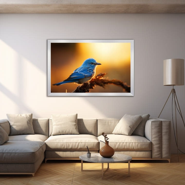 Blue bird canvas of a small blue bird on a twig against a warm golden sunset haze