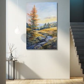 Pastel autumn landscape with a golden larch tree and a stream in a meadow