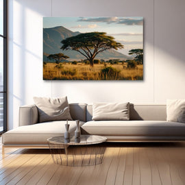 African savannah landscape with acacia tree and mountains at dusk