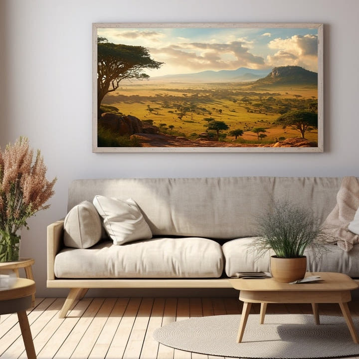 Savanna valley in golden afternoon light framed by an acacia tree
