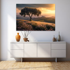 Lone olive tree on Tuscan hills at golden sunset above a pink wildflower meadow