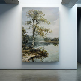 Lakeside landscape with a leaning silver birch over still water and distant woodland