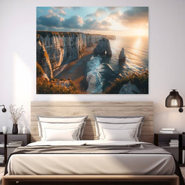White cliffs and arch of Etretat above a glittering sea at sunset