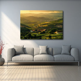 Vineyard hills and terracotta-roofed villas at golden sunset