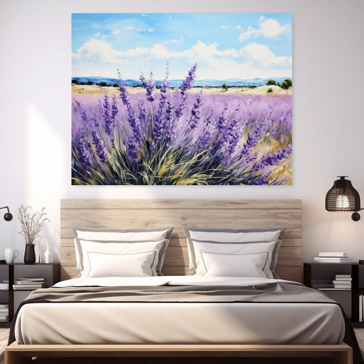 Tall lavender flowers against golden grasses and a bright summer sky