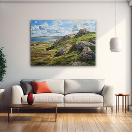 Coastal heath with granite boulders and golden grasses beside a calm bay