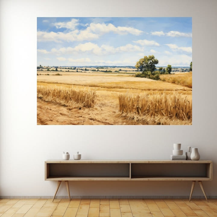 Ripe barley fields under a wide blue summer sky with drifting clouds