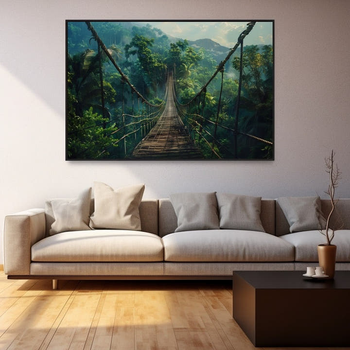 Rope suspension bridge crossing a misty rainforest valley lit by morning sun