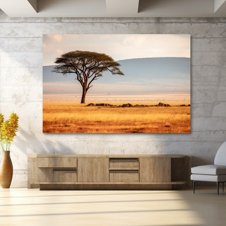 Lone acacia tree over golden savanna grasslands with distant hills at golden hour