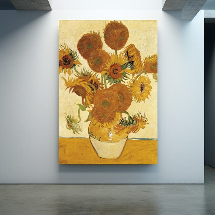 Van Gogh sunflowers in amber and russet in a cream vase on a sandy ground